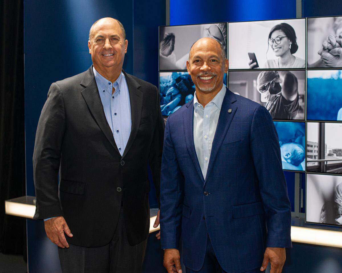 Advocate Aurora Health CEO Jim Skogsbergh, left, and Atrium Health CEO Gene Woods. Both men will be co-CEOs of the combined health system for the first 18 months. Then Skogsbergh will retire and Woods will become the lone CEO.