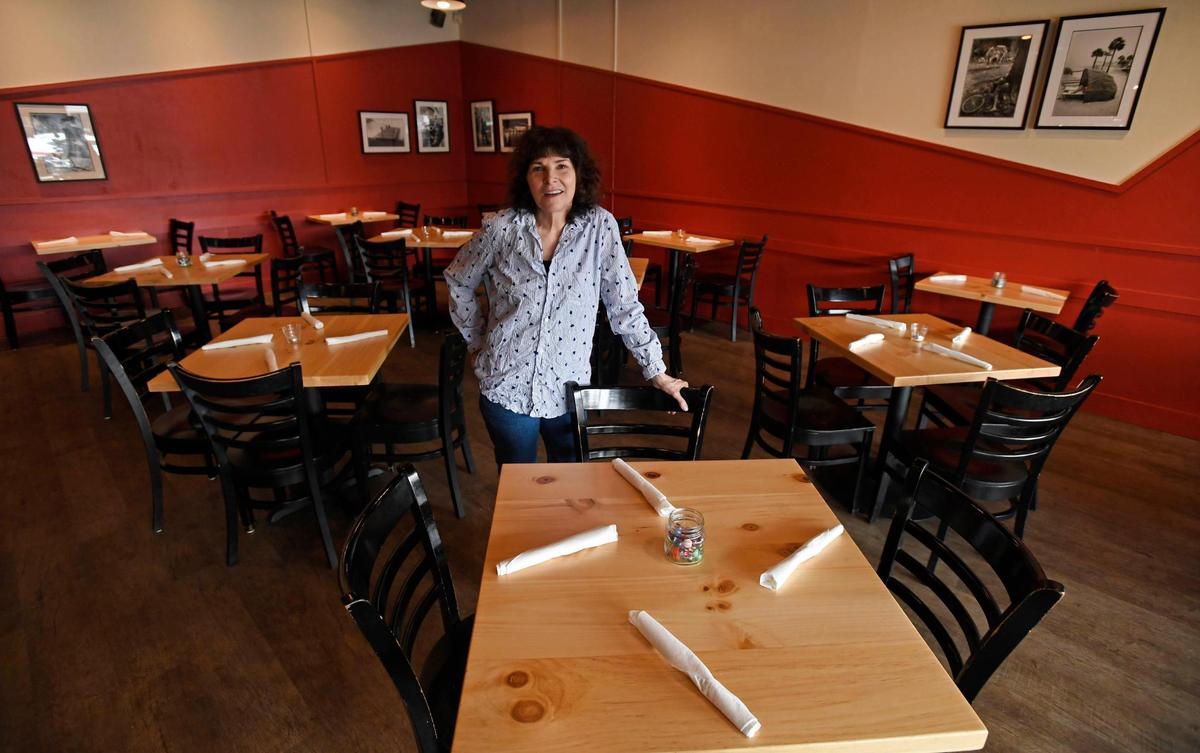 Owner Fran Scibelli shows off the dining room of Fat Cat Burgers + Bakeshop.