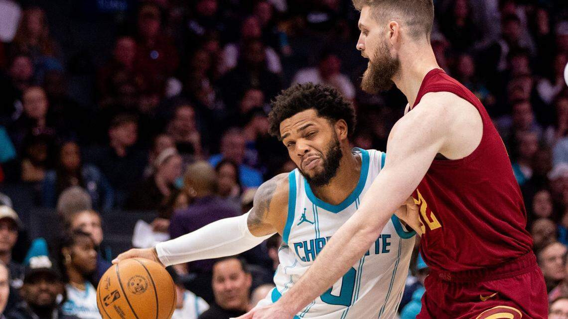 Charlotte Hornets forward Miles Bridges (0) drives on Cleveland Cavaliers forward Dean Wade (32) during the second quarter at Spectrum Center.
