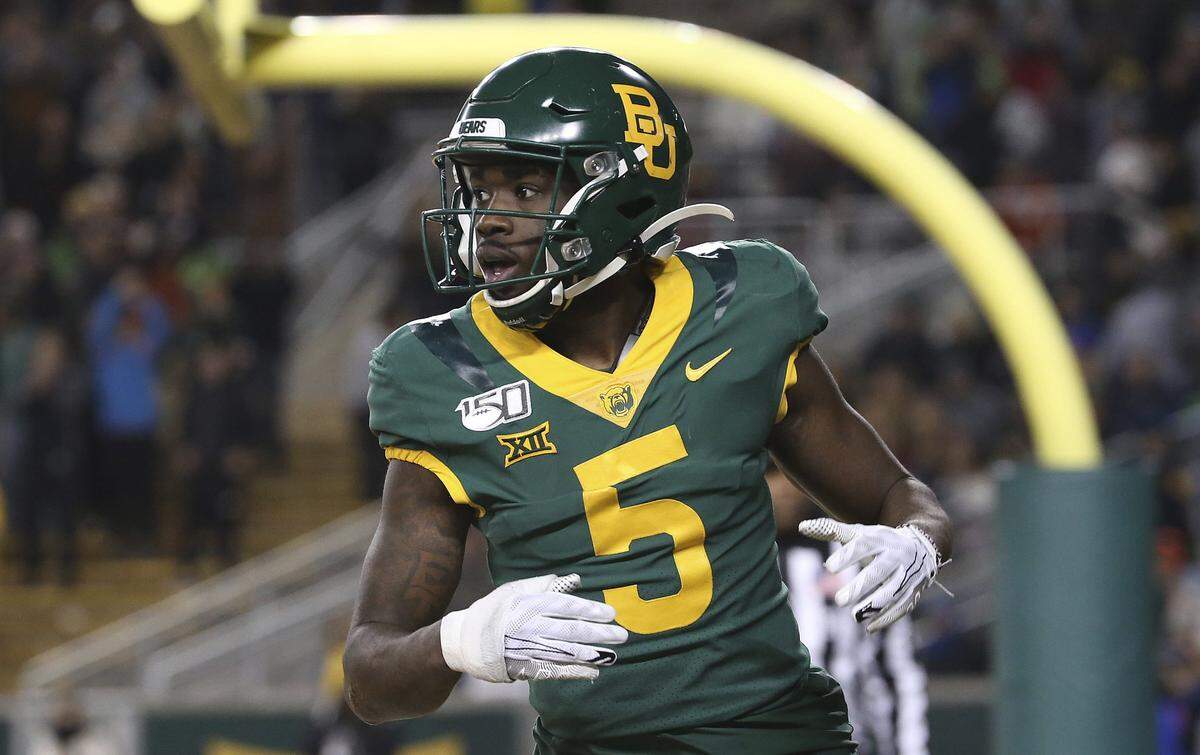 Baylor wide receiver Denzel Mims (5) looks over to the side line after a touchdown in an NCAA college football game against West Virginia in Waco, Texas, Thursday, Oct. 31, 2019. (AP Photo/Jerry Larson)