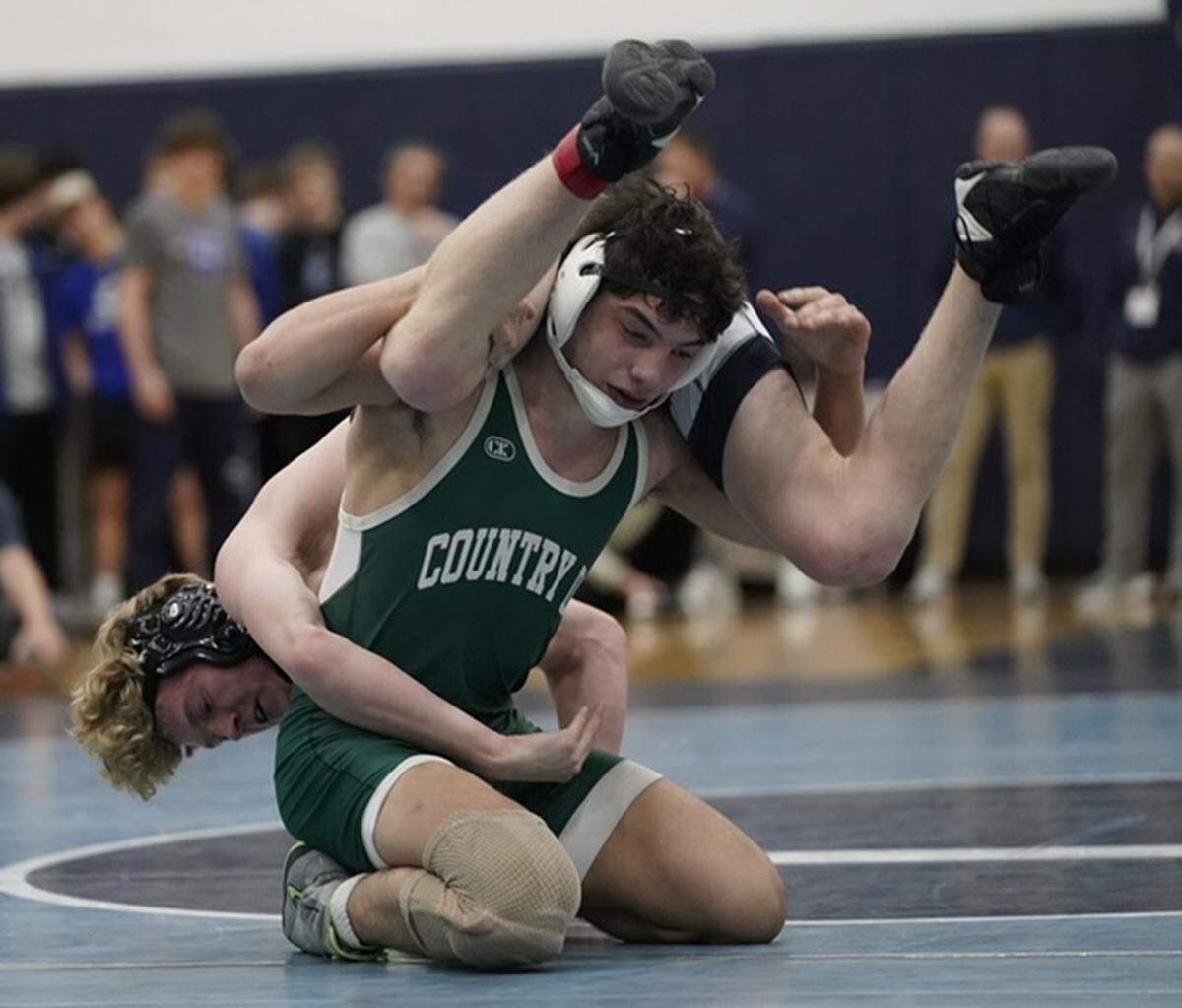 Charlotte Country Day's Nicholas Arado, right, tries to break free of a hold from Cary Christian Eian Holmes during their 144-pound championship match Saturday at the N.C. Independent Schools Athletic Association's state championships in Charlotte. BY BILL KISER/SPECIAL TO THE OBSERVER