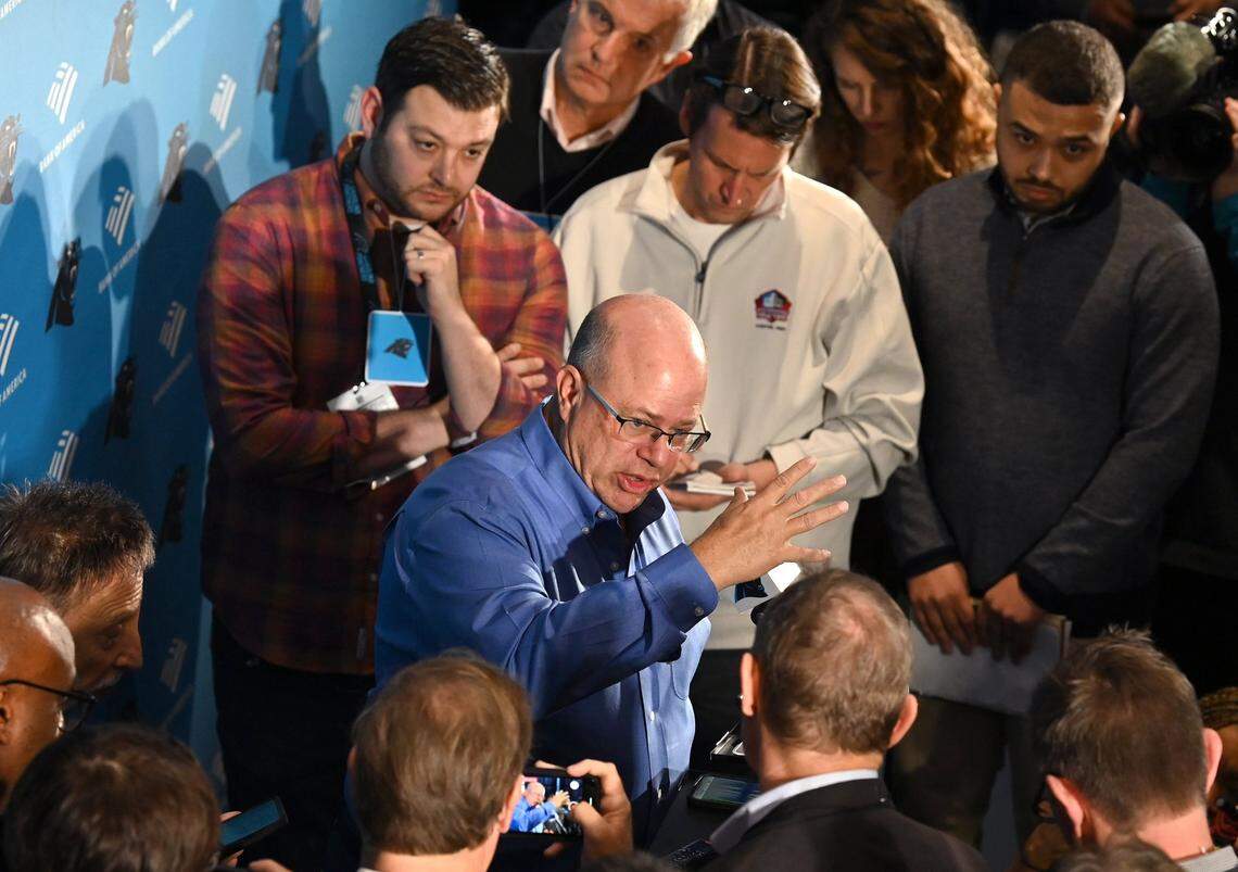 Carolina Panthers team owner David Tepper, center, answers questions from the media following the introductory press conference for new head coach Frank Reich at Bank of America Stadium on Tuesday, January 31, 2023.