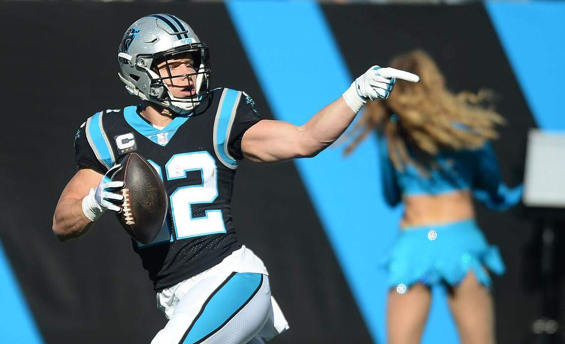 Carolina Panthers running back Christian McCaffrey points toward the stands after rushing for yardage against the New England Patriots defense second quarter action at Bank of America Stadium in Charlotte, NC on Sunday, November 7, 2021.