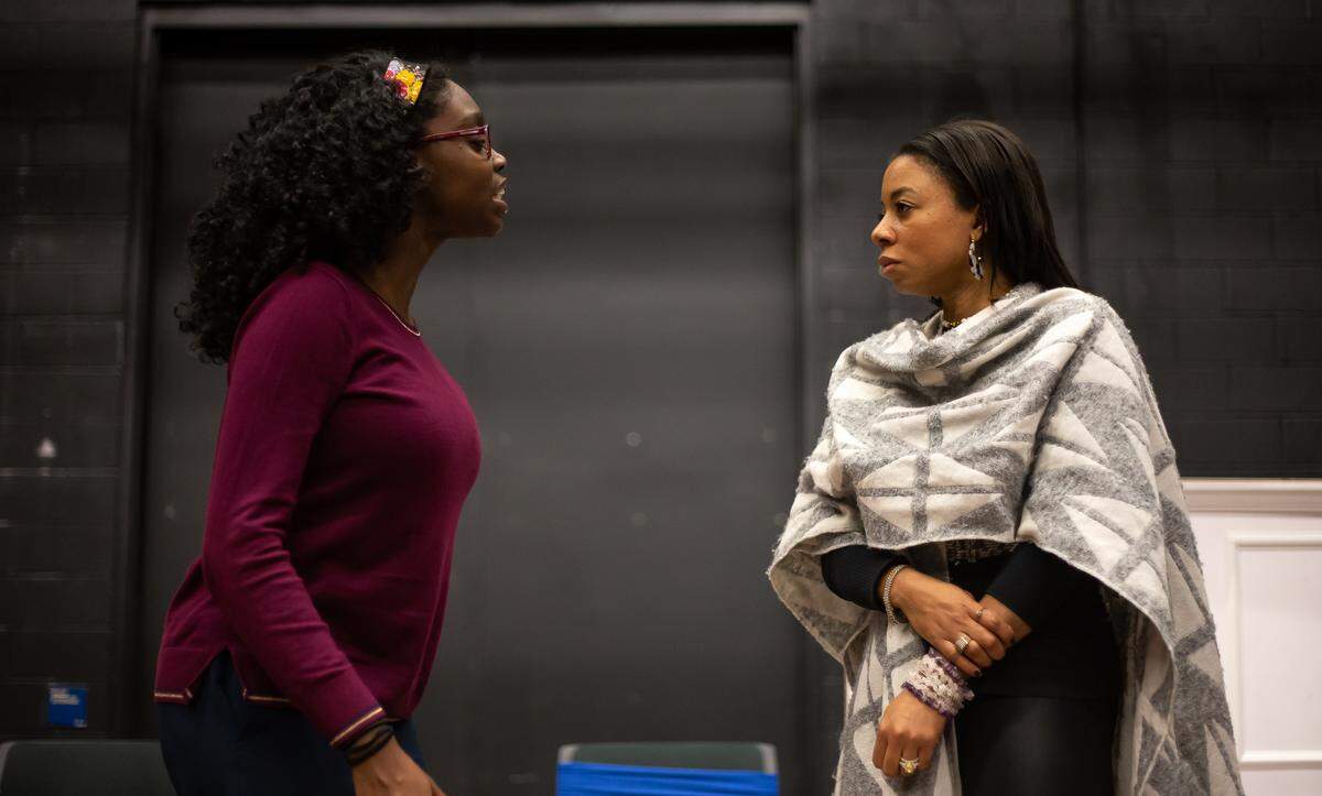 Destiny Stone, left, talks with Krystal Gardner at rehearsal.