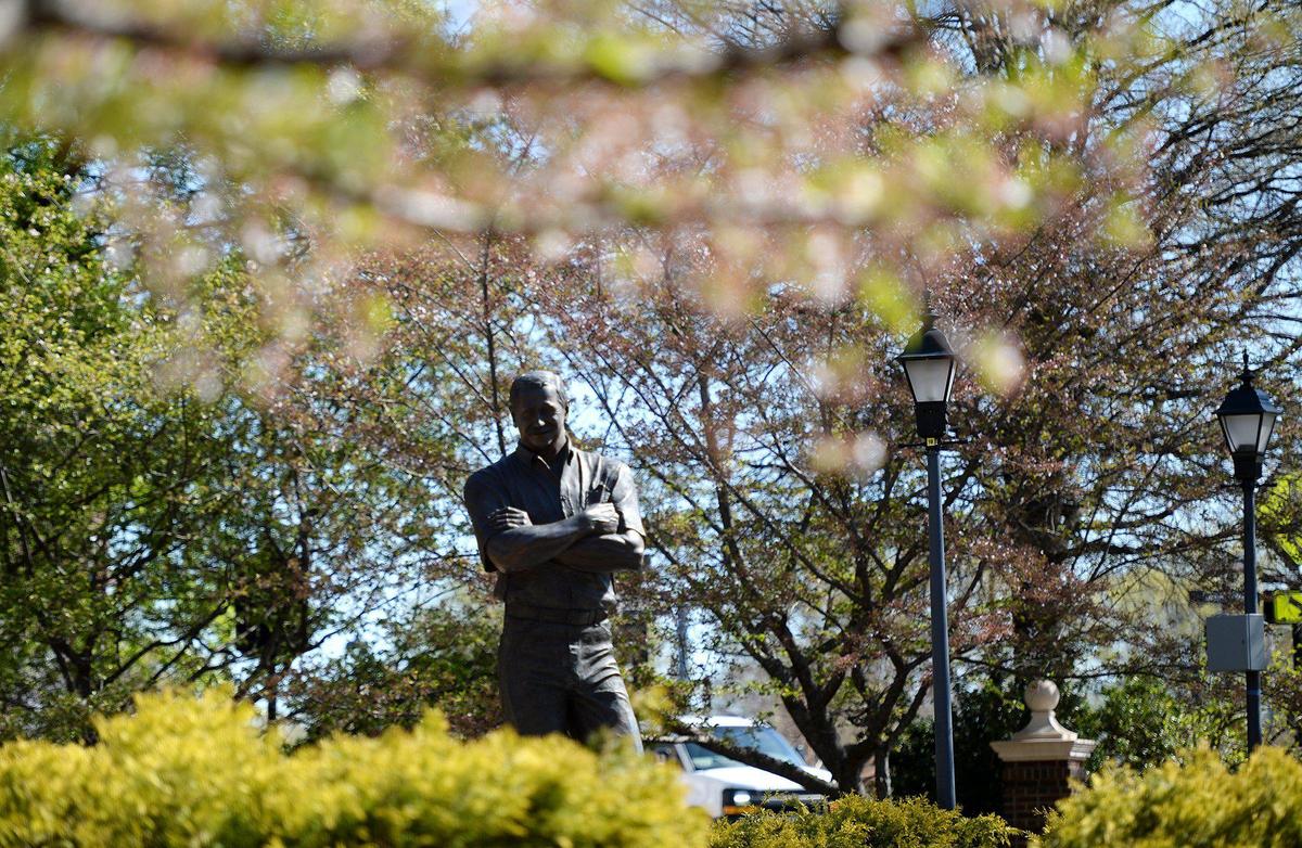 A statue of Kannapolis’ most famous native son, Dale Earnhardt, stands in the Dale Earnhardt Tribute Plaza dedicated to him, overlooking new construction of 200 Main. Local leaders, in Kannapolis, N.C., want to create a plan with public input to guide growth while persevering the town’s charm. With downtown growing in population and popularity, city leaders are looking to preserve the area’s small-town vibe while preparing for the seemingly inevitable continued influx of new residents. Photos of downtown Kannapolis were made on Thursday, Mar. 27, 2025.