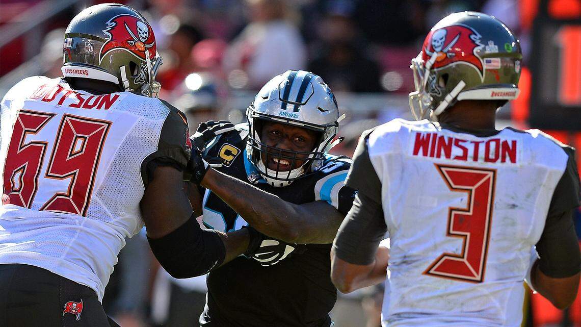 Carolina Panthers linebacker Thomas Davis, center, battles Tampa Bay Buccaneers tackle Demar Dotson, left, in an attempt to rush quarterback Jameis Winston, right, during fourth quarter action at Raymond James Stadium in Tampa, FL. on Sunday, October 29, 2017. The Panthers defeated the Buccaneers 17-3.