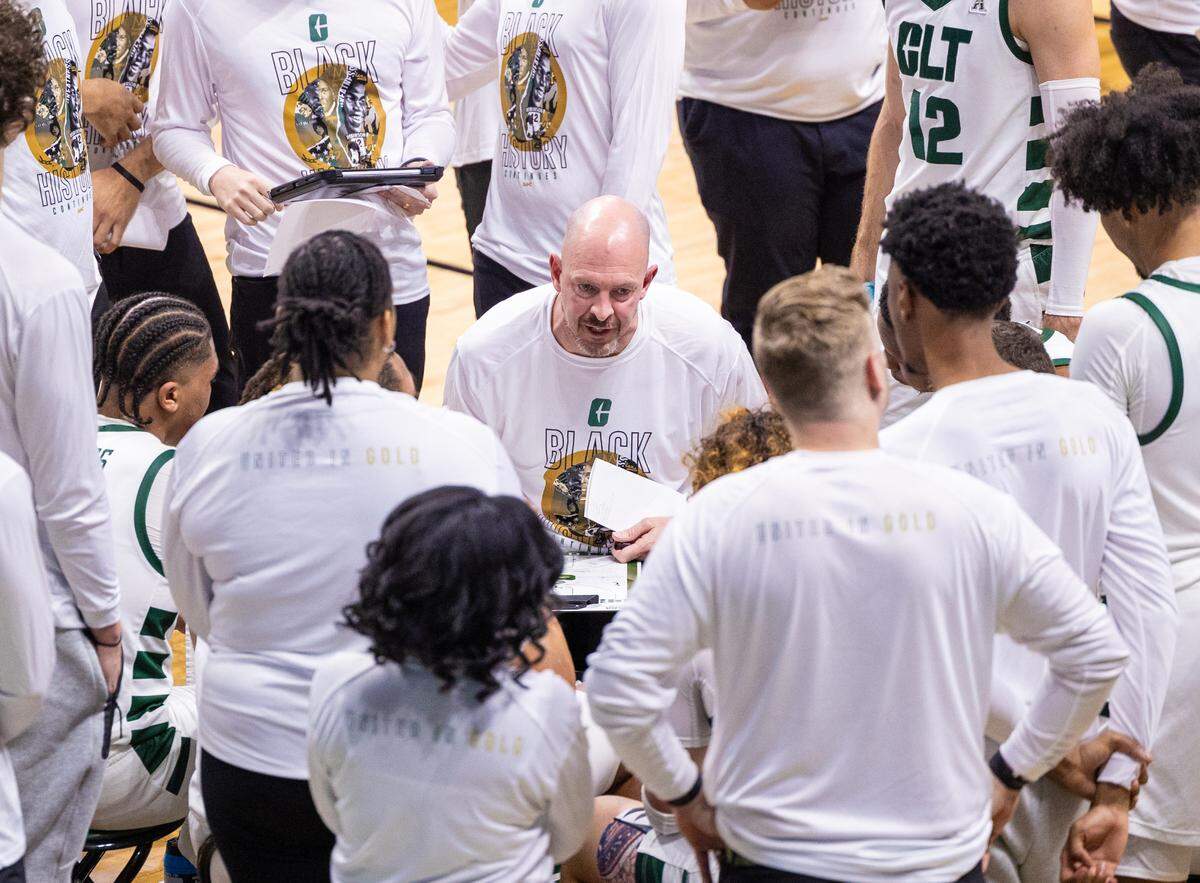 Charlotte head coach Aaron Fearne draws up a play during a timeout against UTSA during a matchup at the Halton Arena in Charlotte on Thursday, February 15, 2024.