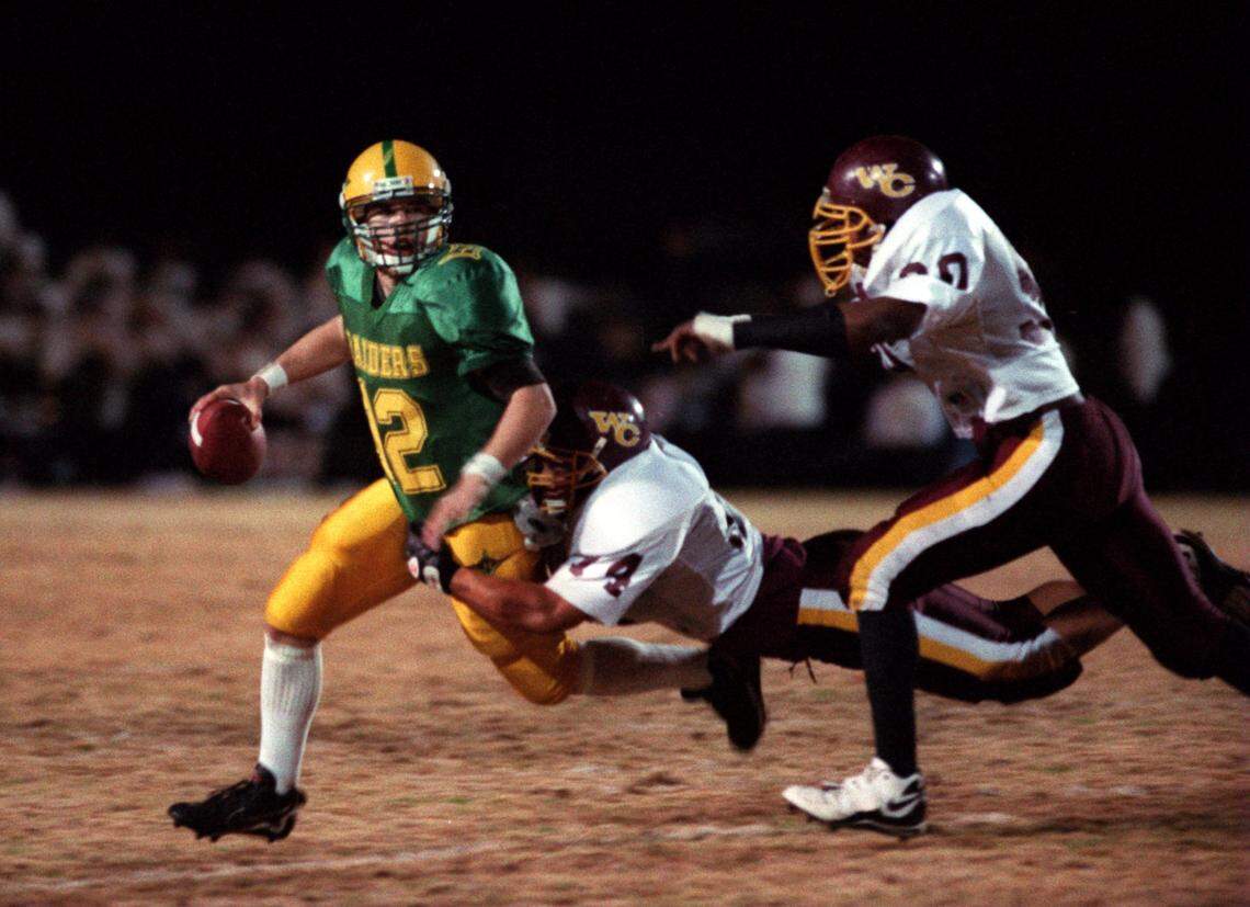 Richmond Senior football coach Brad Denson is the state’s highest-paid public school football coach. Denson also attended teh school and was the team’s quarterback, seen here in a 1997 file photo.