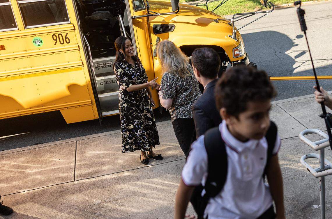 CMS Superintendent Dr. Crystal Hill arrives with a bus of students during the first day of school at Elizabeth Traditional School in Charlotte, N.C., on Monday, August 25, 2025.