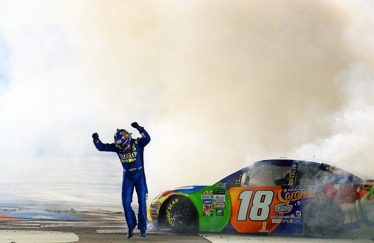 NASCAR driver Kyle Busch jumps into the air at the finish line after winning the NASCAR Monster Energy All-Star Race on Saturday, May 20, 2017 at Charlotte Motor Speedway in Concord, NC. 
