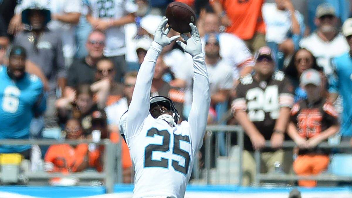 Carolina Panthers safety Xavier Woods leaps to disrupt a pass to Cleveland Browns wide receiver Amari Cooper during first quarter action at Bank of America Stadium on Sunday, September 11, 2022.