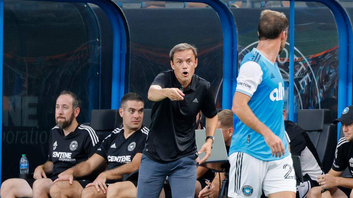 Charlotte FC head coach Christian Lattanzio talks to Charlotte FC defender Christian Fuchs in the first half against Orlando City in Charlotte, N.C., Sunday, Aug. 21, 2022.