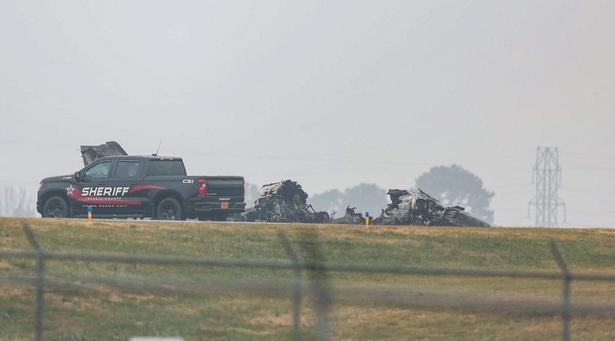 Wreckage of a crashed plane is seen at Statesville Regional Airport on Thursday, Dec. 18. According to the officials, the plane is owned by NASCAR driver Greg Biffle.