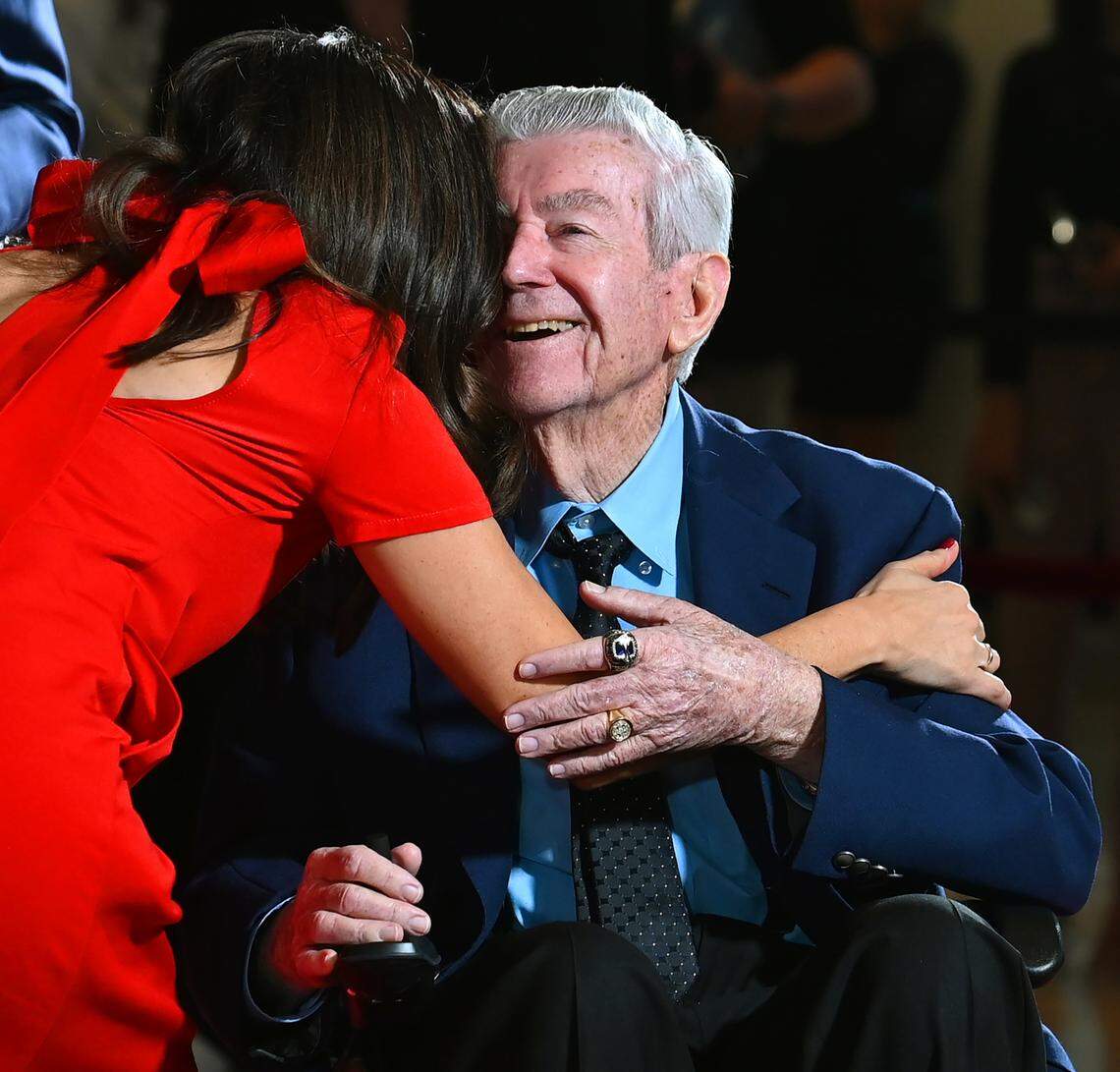 NASCAR Hall of Fame member Bobby Allison smiles as he receives a hug along the red carpet at the NASCAR Hall of Fame in Charlotte, NC on Friday, January 19, 2024.