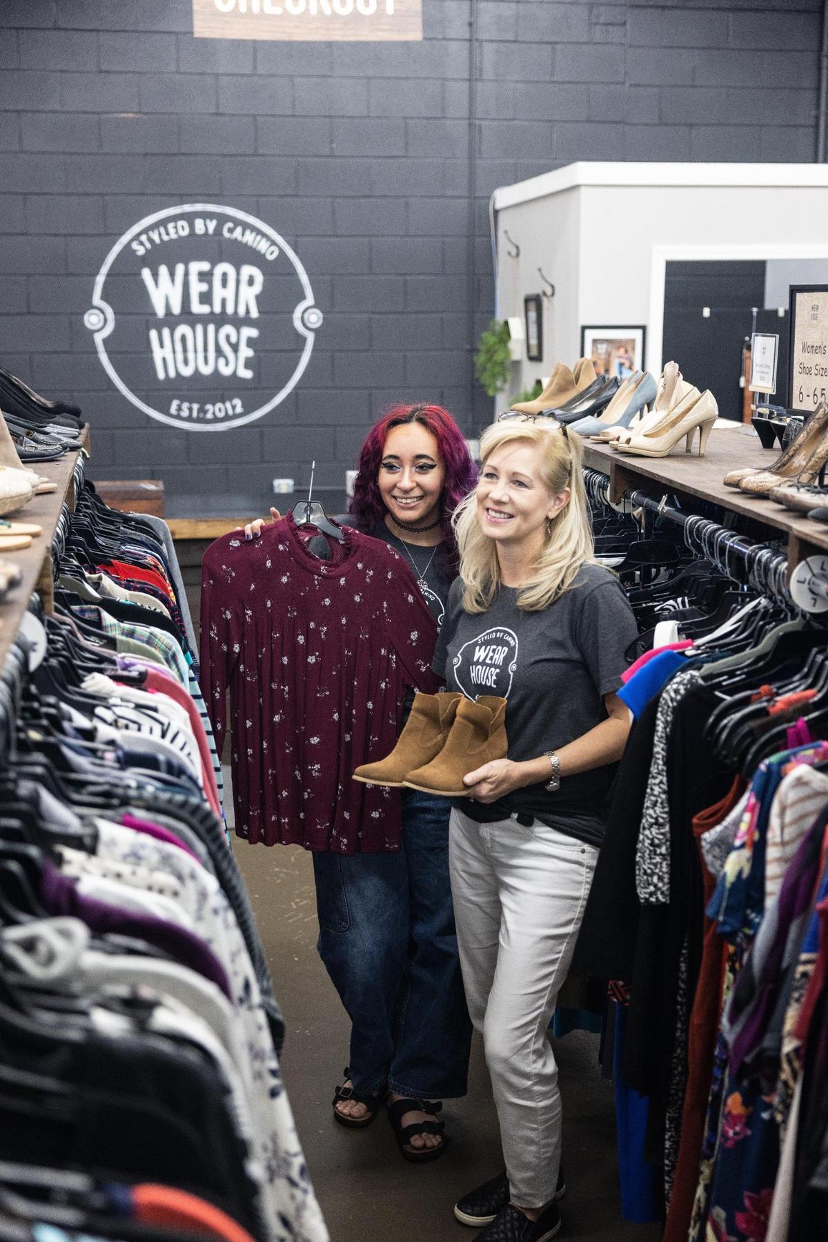 Kaylee Rivera, left, and Jill Price work Aug. 31 at The WearHouse in Charlotte. The thrift store is run by the nonprofit Camino and was chosen as best thrift store in the region in The Charlotte Observer’s recent 2022 Reader’s Choice contest.