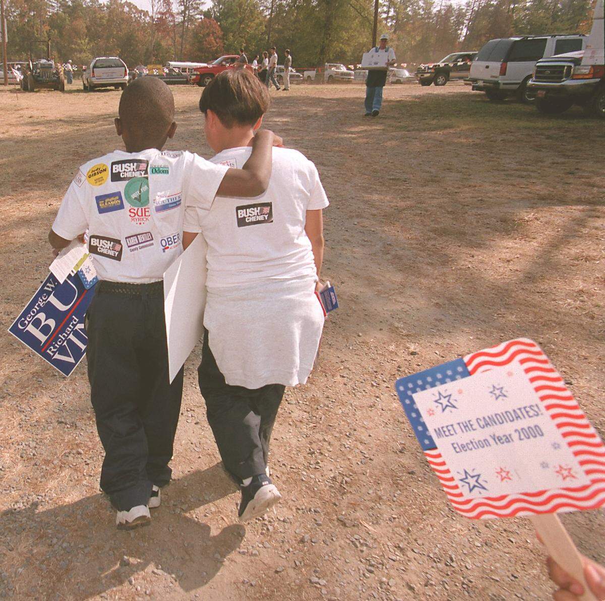 Brandon Brewer 9, left, and Joel Ramirez, 9, leave the Mallard Creek BBQ Thursday afternoon Oct. 26, 2000. The two boys are students at Saint Augustine Academy. 