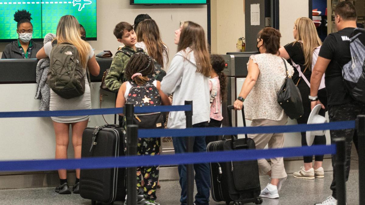 Lines form at ticket counters at the Charlotte Douglass International Airport. Ticket prices went up according to a study from SmartAsset. 