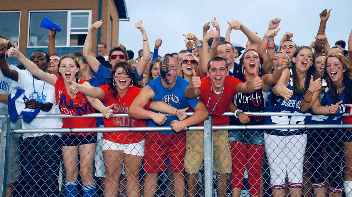 North Mecklenburg Vikings fans cheer on their team during the first half of the Lake Norman at North Mecklenburg High School football game in Huntersville, NC.