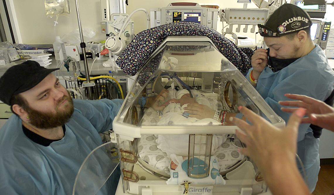 After a c-section delivery, Liam and Duane visit the NICU nursery multiple times a day. Almost 48 hours pass before Liam can pick Cypress up for the first time.