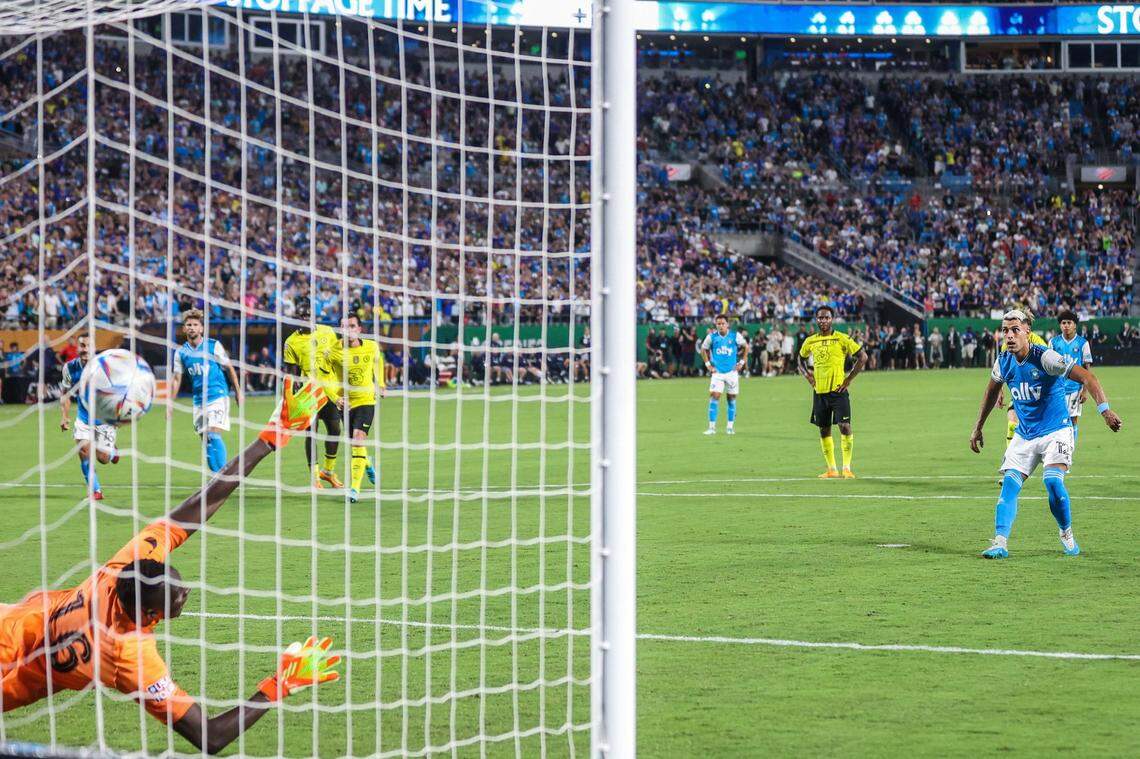 Charlotte FC’s Daniel Rios, far right, watches as the ball flies past Chelsea FC’s goal keeper Eduard Mendy during a penalty kick at Bank of America Stadium on Wednesday, July 20, 2022 in Charlotte, NC. The goal by Rios tied the match, 1-1, which resulted in a penalty shootout that Charlotte FC won, 5-3.