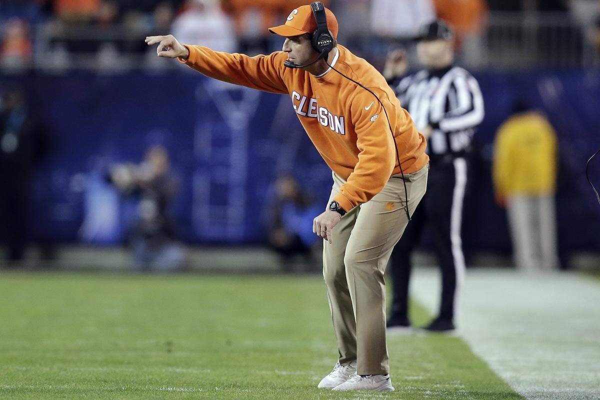 Clemson head coach Dabo Swinney directs his players against Virginia Saturday night in the ACC championship. Swinney’s Clemson teams have won their last 28 games in a row.