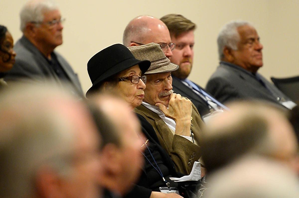 Audience members listen to comments on the planned merger of BB&T and SunTrust during a public hearing on Thursday, April 25, 2019 at the Charlotte branch of the Federal Reserve Bank of Richmond.