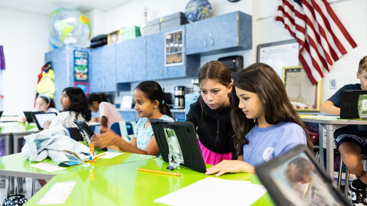 A 5th grade class sets up their iPads during the first day of school at Lake Norman Charter School in Huntersville, N.C., on Thursday, August 10, 2023. U.S. News & World Report ranked Lake Norman as the No. 7 elementary school in North Carolina its 2024 Best Schools list.