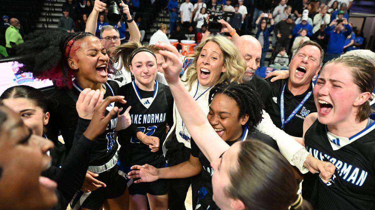 The Lake Norman girls basketball team celebrate their 43-41 victory over Wakefield in the girls NCHSAA 4A State Championship game on Saturday, March 15, 2025 at Lawrence Joel Veterans Memorial Coliseum in Winston-Salem, NC. 