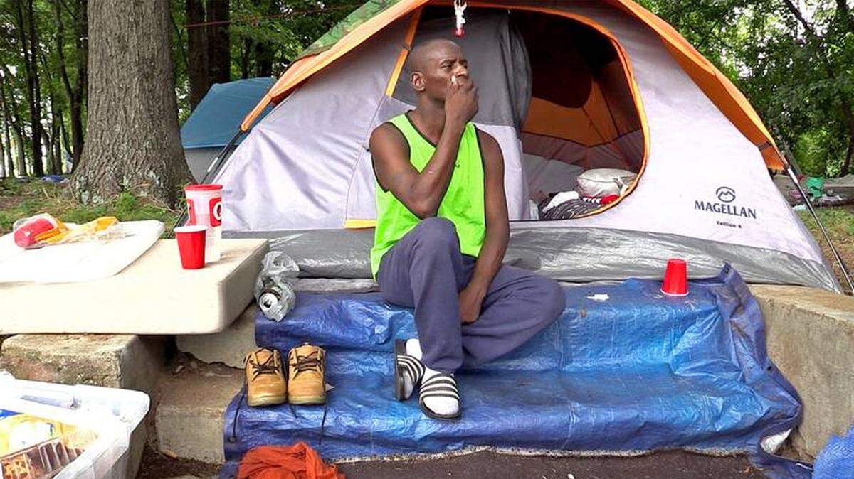 Anthony Martin (above) was among the more than 200 people who lived in a tent encampment near uptown that was cleared in mid-February. This week Charlotte City Council member Tariq Bokhari floated the idea of making it a misdemeanor for individuals to give food, money or clothing to people who are homeless.