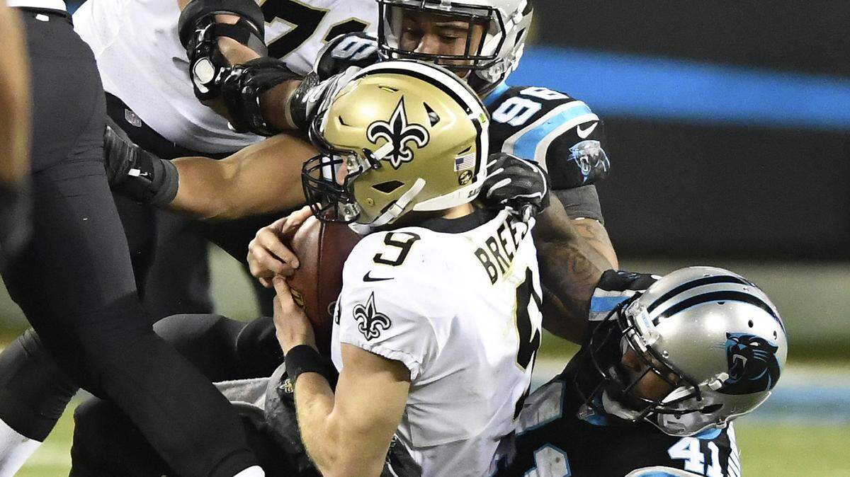 New Orleans Saints quarterback Drew Brees (9) is sacked by Carolina Panthers defensive back Captain Munnerlyn (41) during the second half at Bank of America Stadium in Charlotte, N.C., on Monday, Dec. 17, 2018. The Saints won, 12-9. (David T. Foster III/Charlotte Observer/TNS)