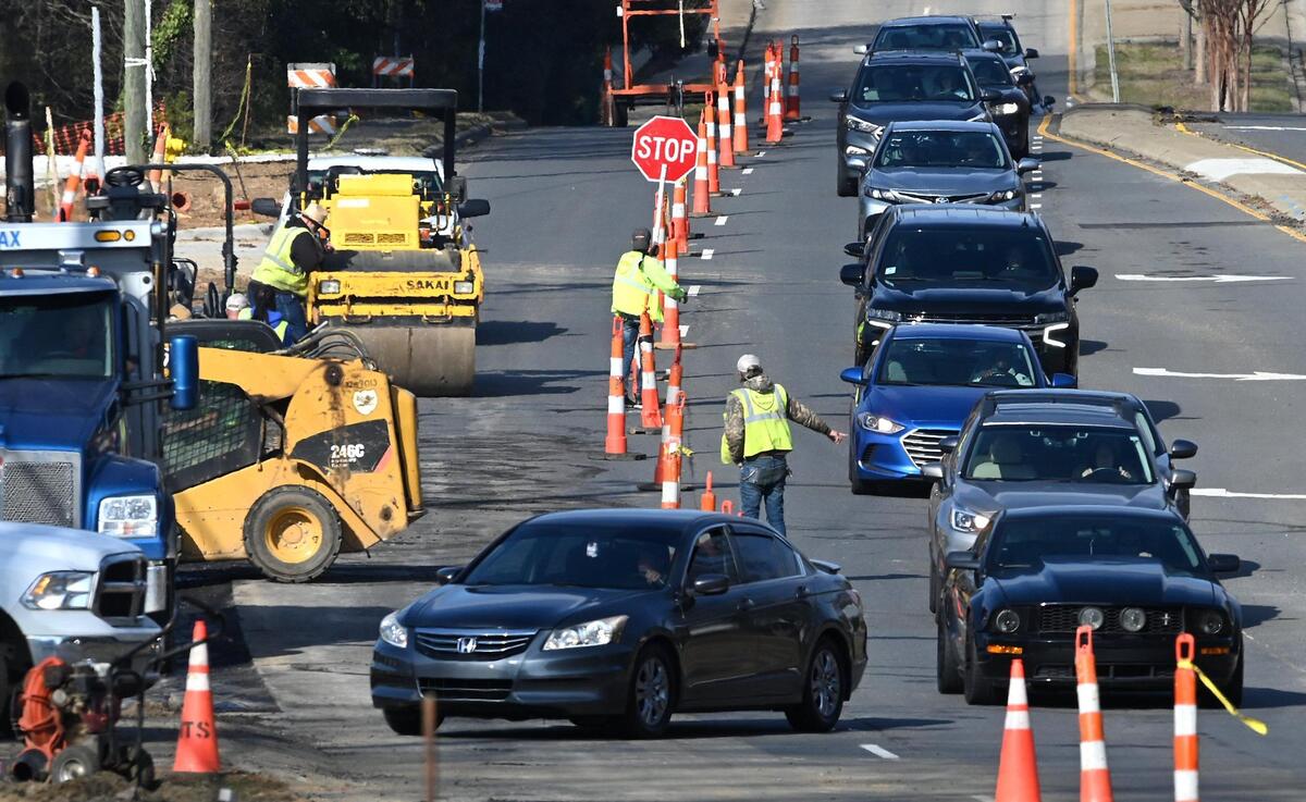 Southbound traffic on Providence Road flows into a single lane past construction near Hamilton Mill Road on Wednesday, January 11, 2023.