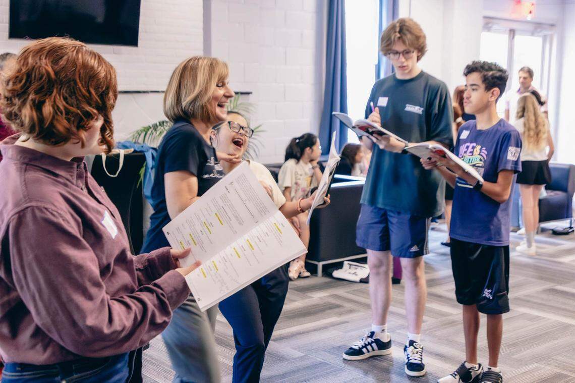 Sharing a laugh at a rehearsal for “Annie, Jr.,” which runs from June 20-22 at Theatre Charlotte.