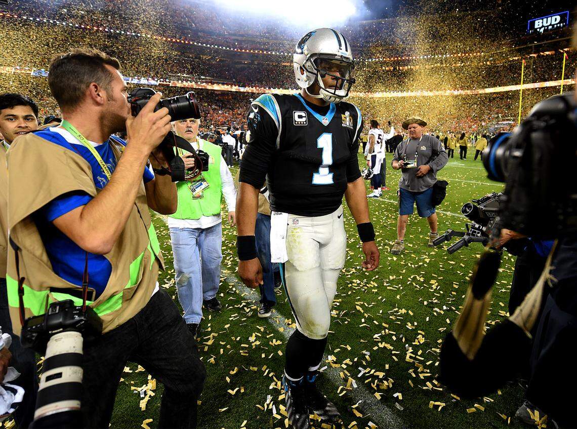 Cam Newton somberly heads for the tunnel after losing to the Denver Broncos, 24-10.
