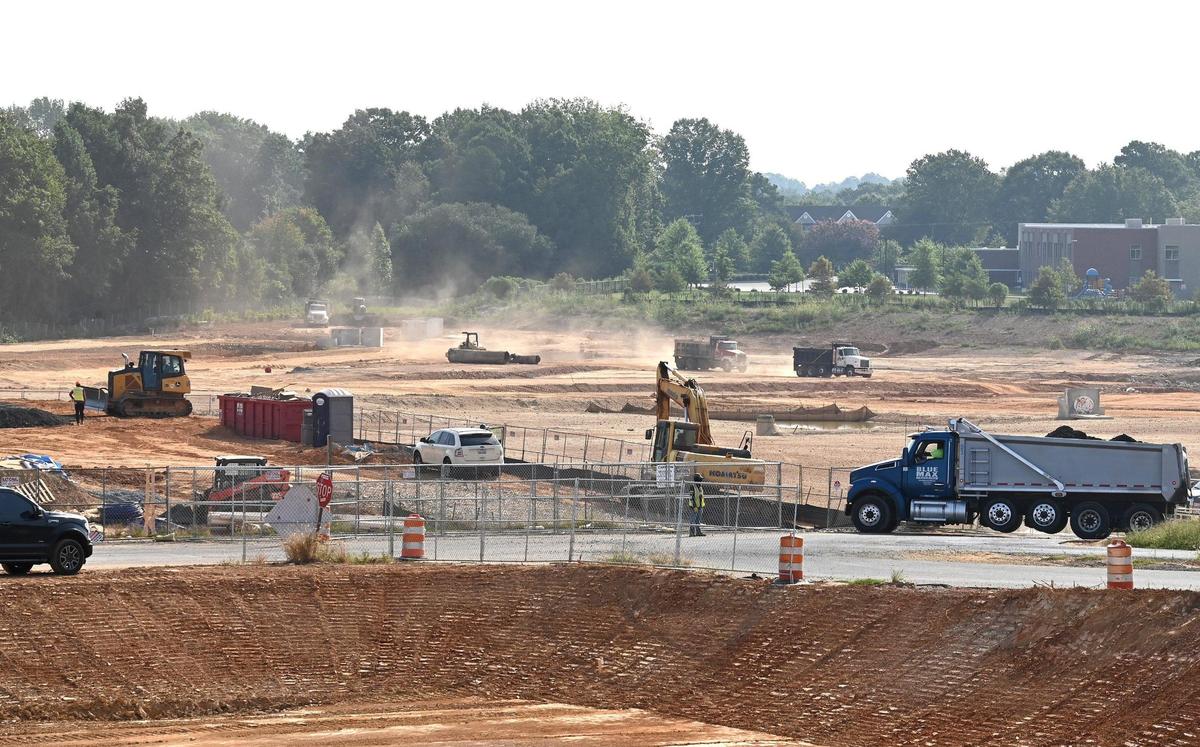 Construction crews work at a portion of the land formerly occupied by Eastland Mall on Thursday, Aug. 24, 2023.