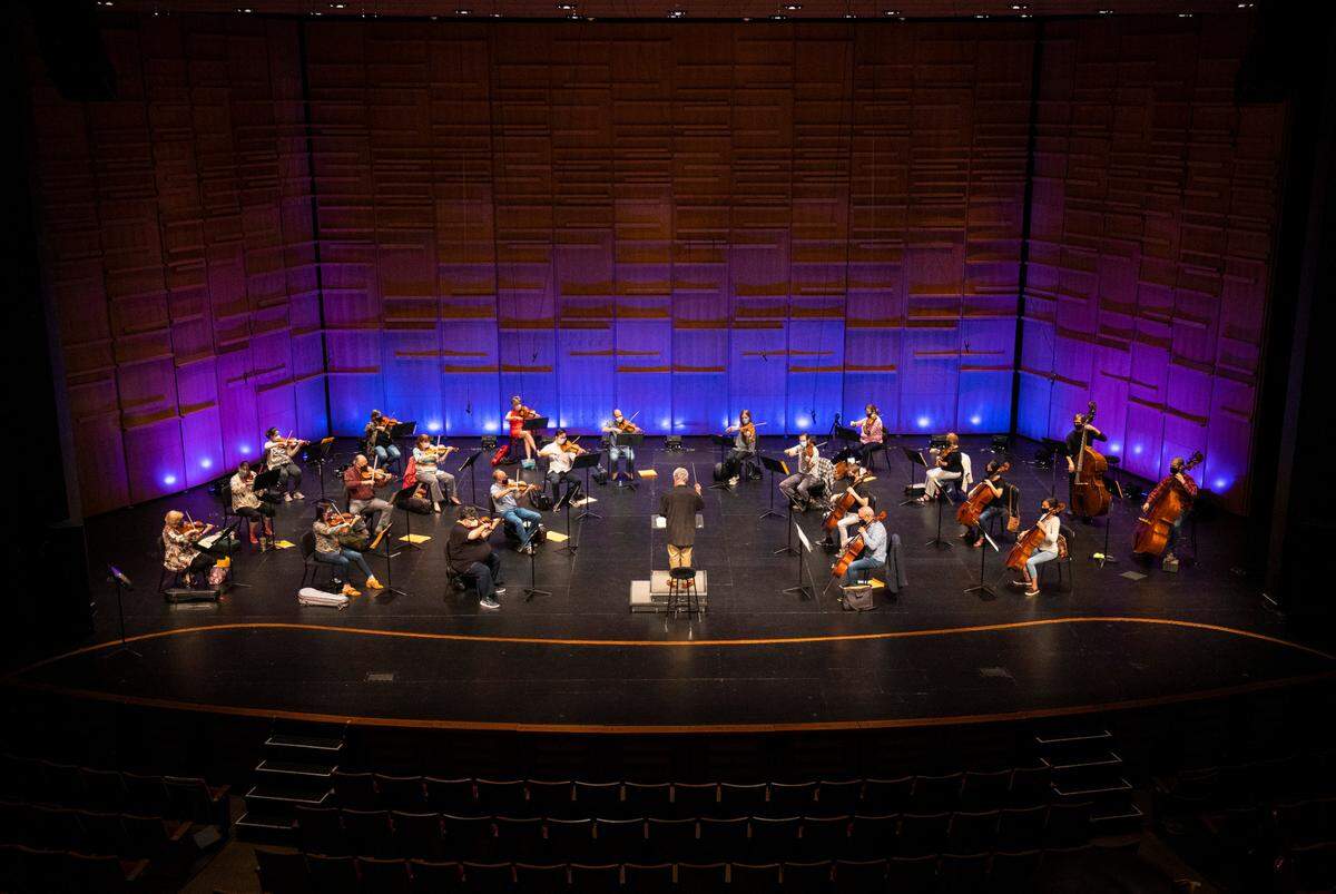 To comply with COVID-19 guidelines during rehearsal the Charlotte Symphony Orchestra was pared down to allow social distancing between musicians.