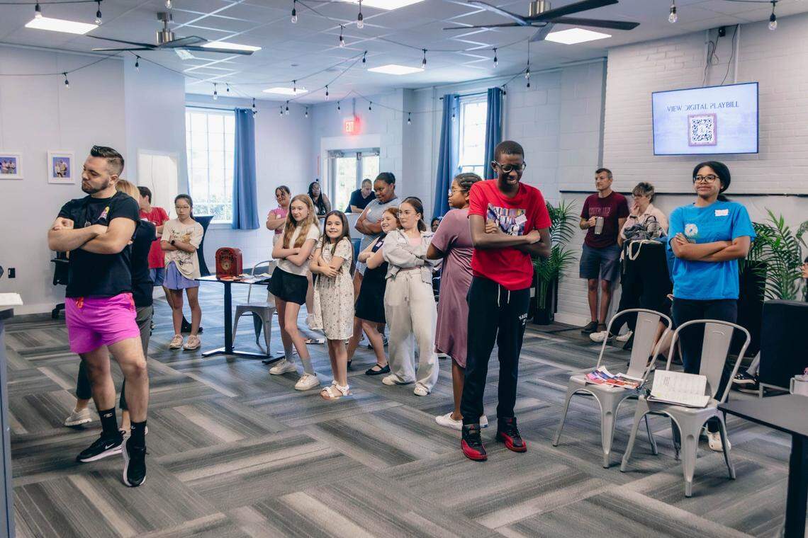 Theatre Charlotte’s cast of Annie, Jr.” and their mentors at a rehearsal for the show.