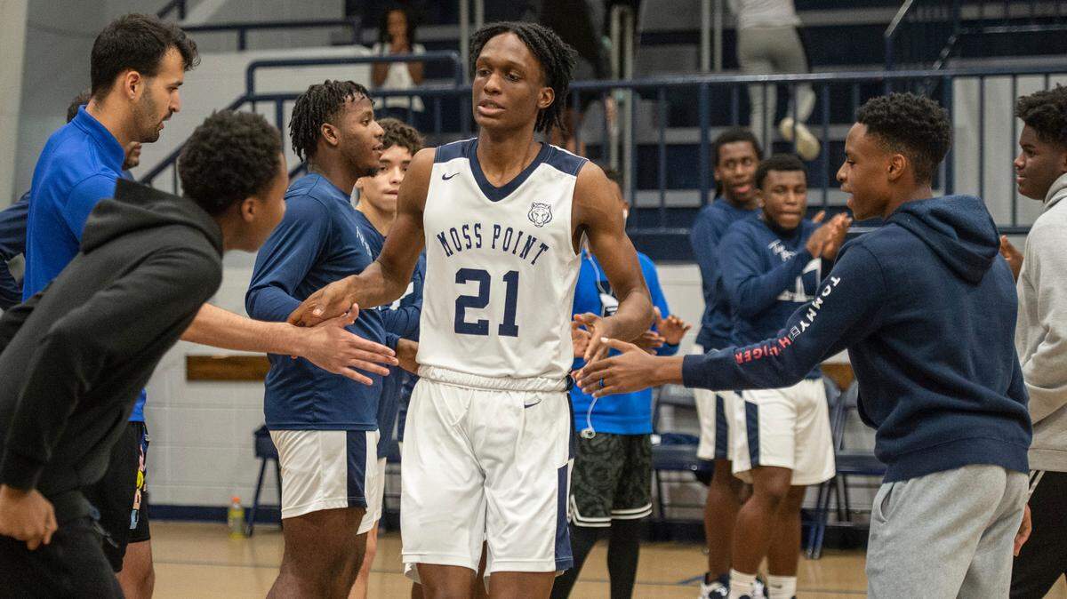 Moss Point forward Kedrick Osby high fives his teammates as he steps out onto the court before a game against Biloxi at Moss Point High School in Moss Point on Tuesday, Dec. 21, 2021.