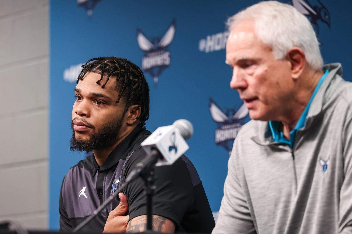 Hornets forward Miles Bridges, left, sits next to President of Basketball Operations and General Manager, Mitch Kupchak,Tuesday. Kupchak called Bridges’ return a “polarizing topic” after he pleaded no contest to felony domestic violence in November.