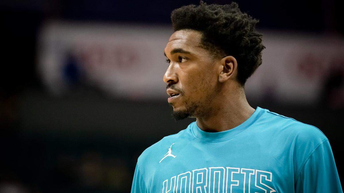 Charlotte Hornet’s guard Malik Monk (center) runs through pre-game routines.