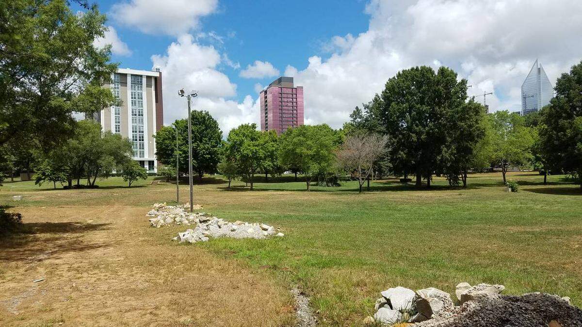 An empty field now sits where the Strawn Cottages once offered affordable housing in Dilworth.