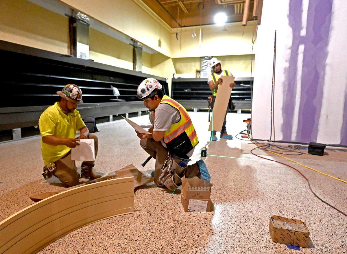 Workers look over floor plans for the Wegmans store in Charlotte on Thursday, May 21, 2026.