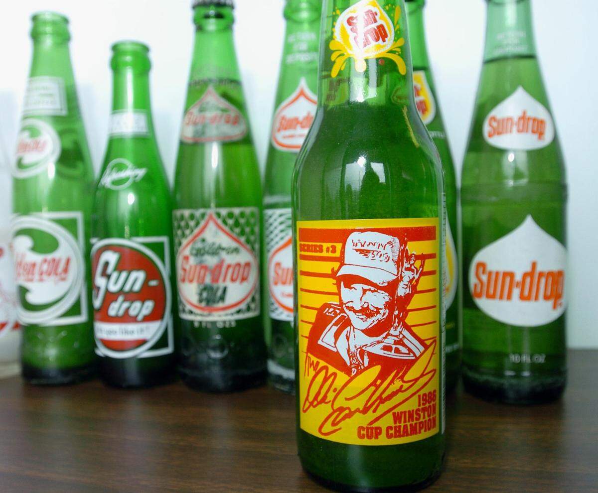In front is the Dale Earnhardt Sun Drop bottle, shown in 2004. Sun Drop was celebrating an anniversary of over 50 years of making the Gastonia golden drink.