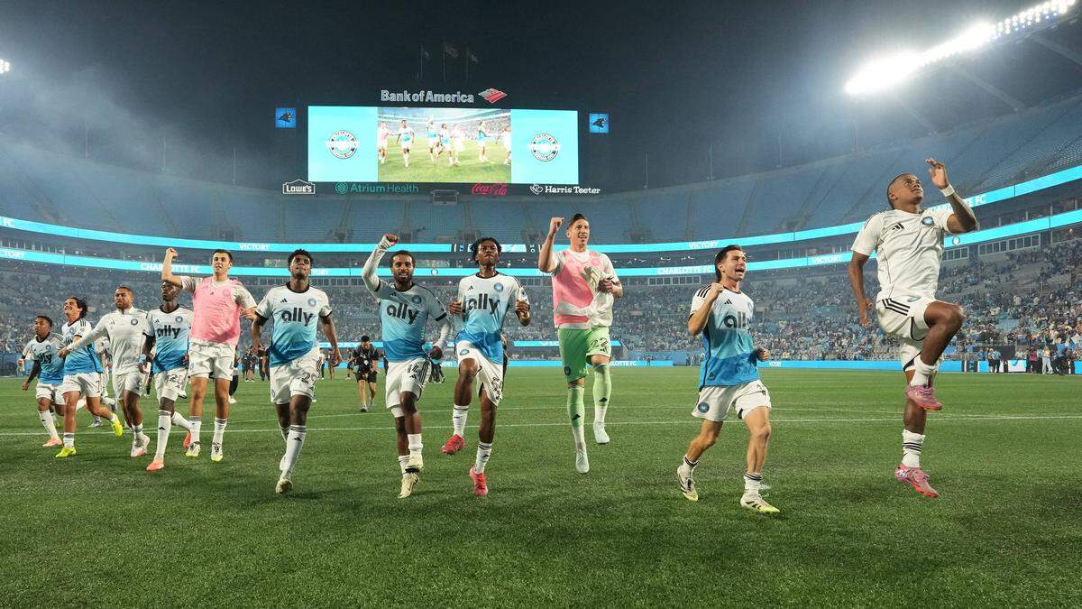 Oct 18, 2025; Charlotte, North Carolina, USA; Charlotte FC players celebrate after the game at Bank of America Stadium. Mandatory Credit: Bob Donnan-Imagn Images
