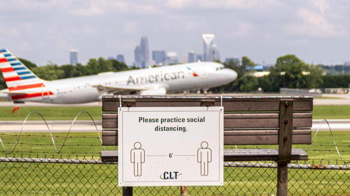 A plane lands at Charlotte Douglas International Airport during the COVID-19 pandemic.