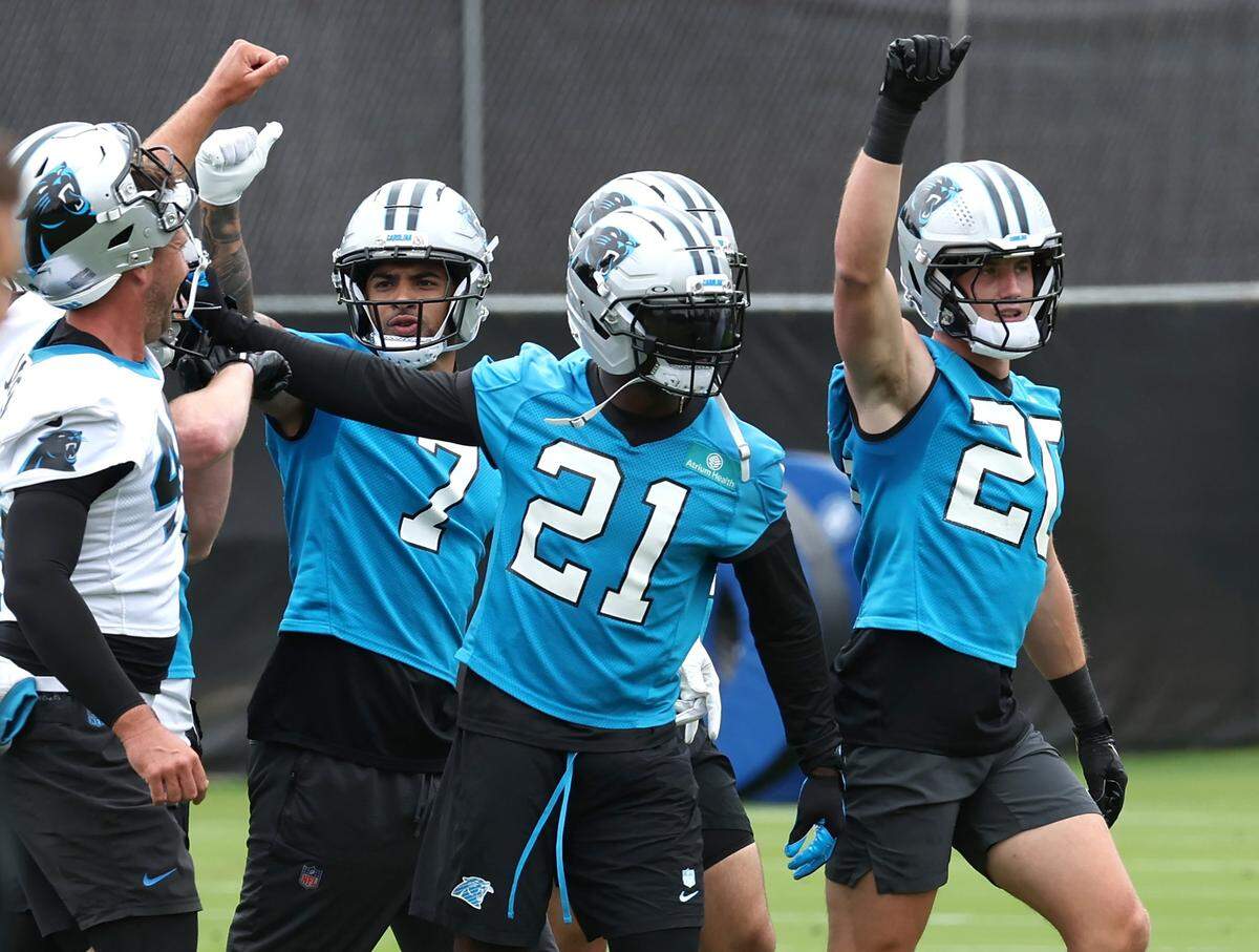 Carolina Panthers safety Jack Henderson, right, gathers with his teammates at the end of a drill during an OTA practice on Tuesday, May 27, 2025.