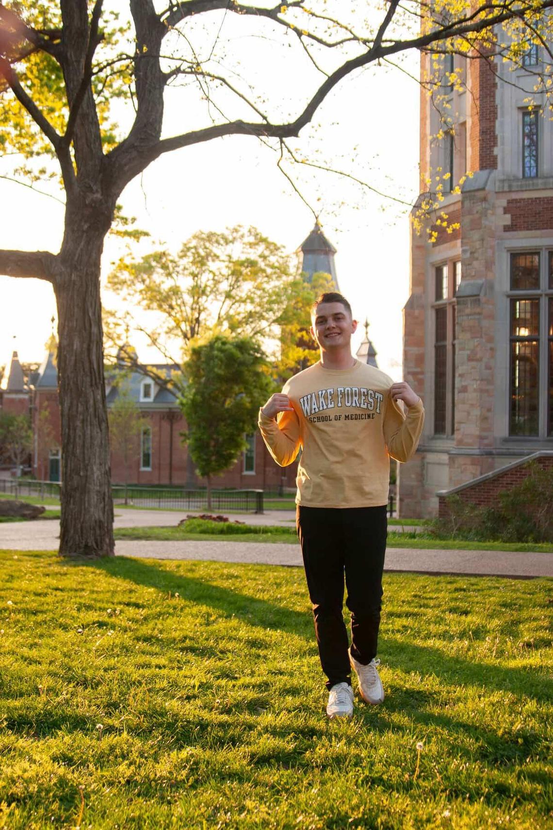Lonnie Smith, wearing a Wake Forest School of Medicine shirt, is looking forward to making history as a member of the inaugural class for the institution’s Charlotte campus.