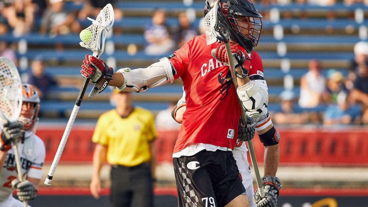 Attackman Josh Zawada holds off a Denver Outlaws defender while attacking the zone. The Carolina Chaos returned home to Charlotte with the Premier Lacrosse League at American Legion Memorial Stadium on June 6, 2025.