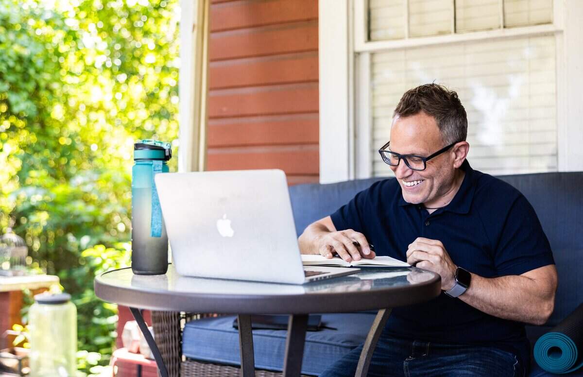 Jason Allen King, a local stand-up comic/writer, works on writing at home in Charlotte, N.C., on Wednesday, May 13, 2026.