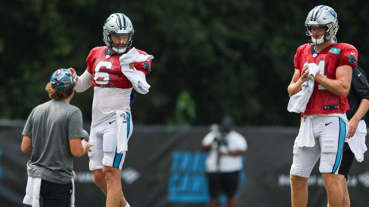 Panthers quarterbacks Baker Mayfield, left, and Sam Darnold, right, work on drills during training camp at Wofford College on Tuesday, August 9, 2022 in Spartanburg, SC.
