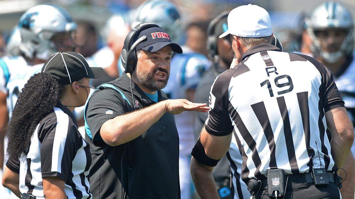Carolina Panthers head coach Matt Rhule, center, speaks with officials following a play against the New York Jets during second quarter action at Bank of America Stadium in Charlotte, NC on Sunday, September 12, 2021. The Panthers defeated the Jets 19-14.